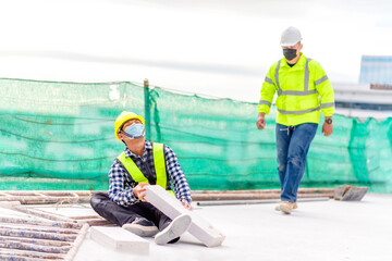 Wall Mural - Accident at construction site. Physical injury at work of construction worker. First Aid Help a construction worker who accident at construction site. First Aid Help at accident in constructions work.