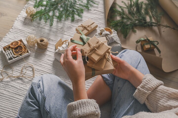 Wall Mural - christmas gift zero waste, eco friendly hand made box packaging gifts in kraft paper wooden table, e
