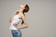 © SHOTPRIME STUDIO - disgruntled woman back pain health problems osteoporosis light background