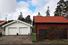 White New Garage For Two Cars And Wooden Barn On Private House Yard.