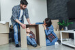 © Тарас Нагирняк - Mortgage, people, family and real estate concept - happy mother, father and little son with cardboard boxes moving to new home!