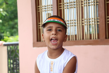 portrait of a smiling child wearing colourful hat