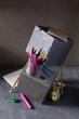 © Sergii Moscaliuk - Back to school concept on table. Study supplies and accessories on concrete cube
