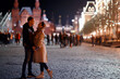 couple in love in moscow night winter, young family evening in winter moscow, autumn style