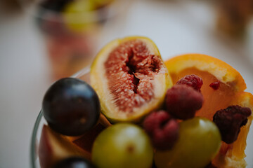 Poster - Closeup shot of tasty fresh cut fruits in the small bowl