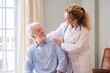 © Daniel - Young female doctor encouraging senior man at home. Doctor helping senior patient and giving care. Female homecaregiver taking care of retired old man. Old man and physician talking at nursing home