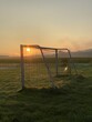© Andreas Don Duering - Fußballtor bei Sonnenaufgang auf einer Wiese am Feldrand. Fussball, Tor, Sonne, morgens, goldenes Licht, Fussballspielen, Frühsport, Training, Wald, Landleben, Leben auf dem Land, sunrise, soccer