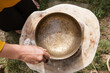 Top view of the movement of water by sound inside a tibetan singing bowl.