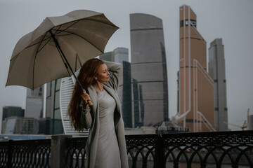 Businesswoman with umbrella