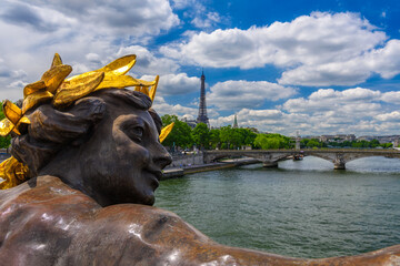 Fototapete - The Nymph reliefs on the bridge of Alexander III with the Eiffel Tower on background in Paris, France. Cityscape of Paris. Architecture and landmarks of Paris.