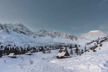 Wall Mural - Beautiful winter views of the High Tatra Mountains with tourists, skiers and amazing states of nature	