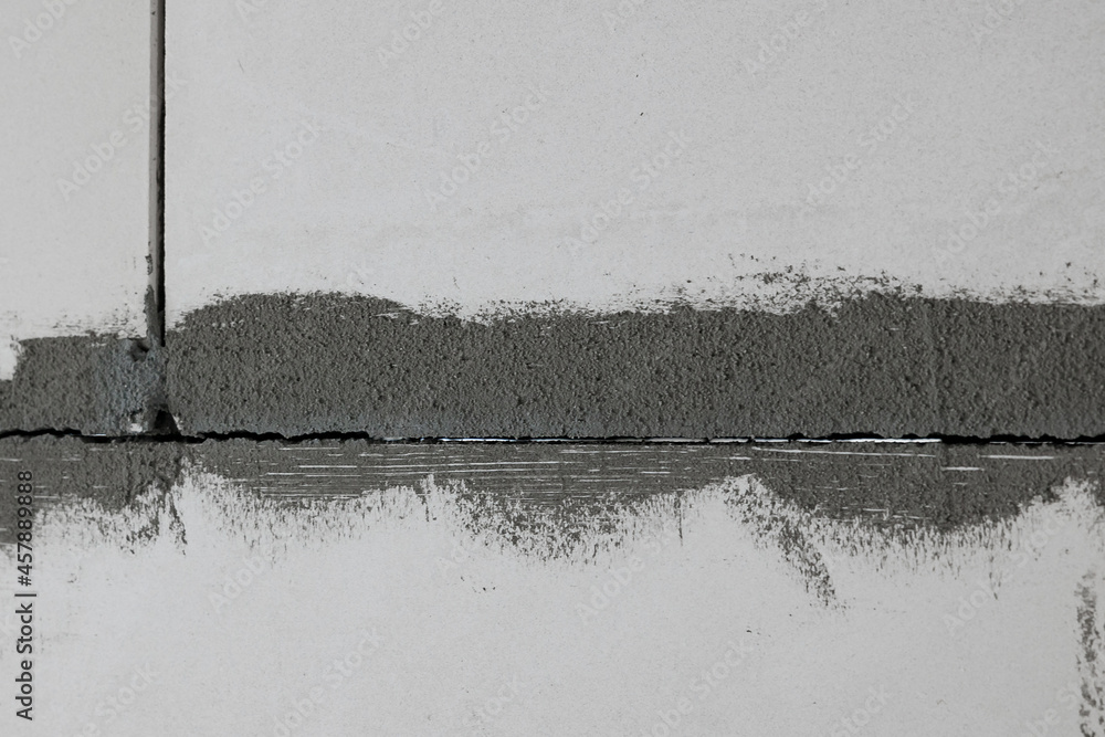 Defects and through cracks in the wall made of foam concrete blocks ...
