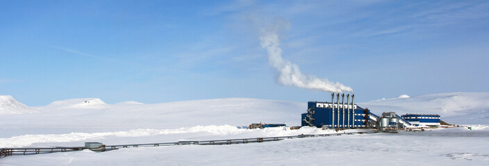 Wall Mural - heating plant in the snowy tundra in the arctic. winter industrial arctic landscape. blue modern ind