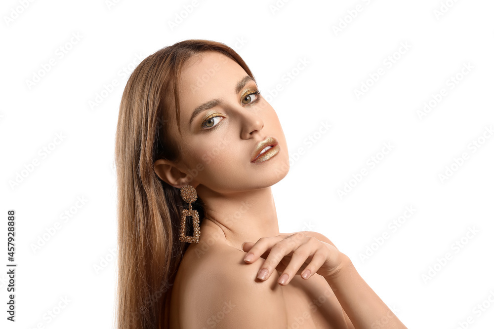 Beautiful young woman with  golden makeup on white background