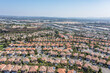 Aerial view of rows of homes in a suburban master planned community