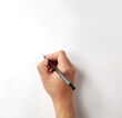 Man hand holding ballpoint pen writing on white background