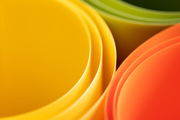 abstract vibrant color curve background, creative graphic wallpaper with orange, yellow and green for presentation, concept of dynamic movement and space, bending plastic sheets, selective focus