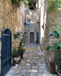 Scenic street alley view of historic houses and buildings in Old Town downtown Yaffa Jaffa, Israel near Tel Aviv with romantic backstreets, parks and medieval facades and skyline