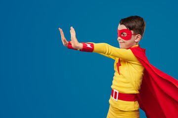 Wall Mural - Superhero kid using superpower