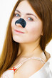 Woman with nose mask pore strips