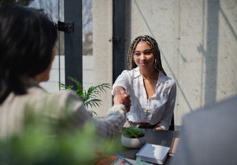 Wall Mural - Happy young woman having job interview in office, business and career concept.