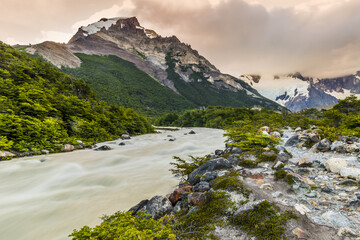 Wall Mural - Sun is setting over the mountains and Fitz Roy river at Los Glaciares National Park