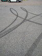 © EsaHiltula - Black tire marks on the parking lot asphalt