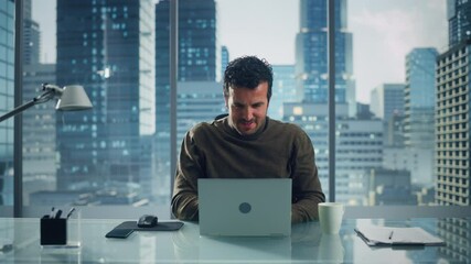 Poster - Portrait of Relaxed Brilliant Businessman Working on Laptop Computer in His Big City Office. Charismatic Excentric Digital Entrepreneur does Data Analysis for e-Commerce Strategy. Zoom In Front View