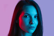 © Lustre Art Group  - Close-up portrait of young beautiful caucasian girl posing isolated over gradient pink purple background in neon lights