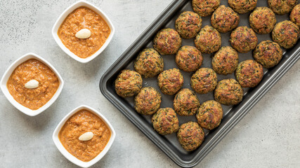 Courgette kofta balls with tomato sauce. Vegan food. Indian cuisine.