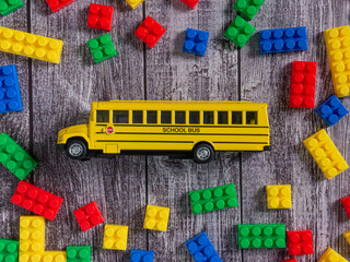 box plastic puzzle multicolour and school bus  for kid or education concept