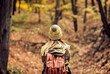 © Zoran Zeremski - Young women enjoying hiking in forest.