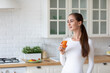 © BestForYou - Healthy woman in the kitchen with fruit juice in her hands