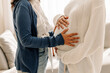 © (JLco) Julia Amaral - Unrecognizable young woman touching her surrogate's pregnant bel