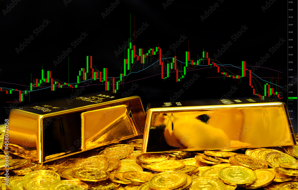 Gold bullion on pile gold coins at trading chart background Stock Photo ...