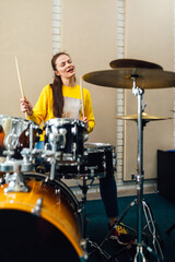 Wall Mural -  woman enjoying drumming rhythmic beat 