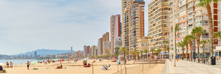 Sticker - Beach of Benidorm at sunny summer day, city skyline horizontal background. Modern skyscrapers seaside and seafront view. Costa Blanca, Province of Alicante. Spain