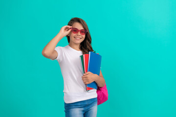 Wall Mural - back to school. knowledge day. education. kid in glasses hold copybook. september 1.