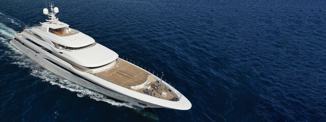 Wall Mural - Aerial drone ultra wide panoramic photo of beautiful modern super yacht with wooden deck cruising in high speed deep blue open ocean sea