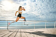 © HBS - Go. Full-length of young disabled woman with leg prosthesis in sports clothing is running on the bridge.