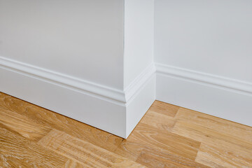 Wall Mural - Detail of corner flooring with intricate crown molding and plinth.