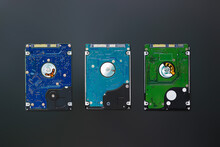 Three 2.5 Inch Hard Disk Drives From The Computer, Hdd Isolated On Dark Background, Top View. Part Of Computer Pc, Laptop