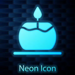 Sticker - Glowing neon Aroma candle icon isolated on brick wall background. Vector