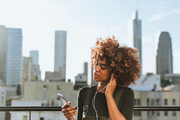 Girl with curly hair at a LA rooftop