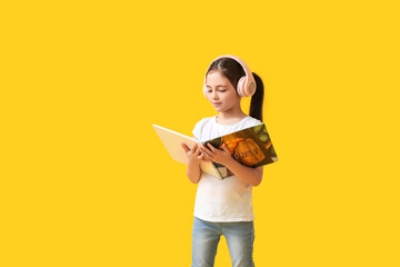 Sticker - Little girl with headphones and book on color background