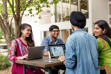 Group of Indian people are using computer laptop
