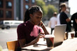 © Rawpixel.com - Woman working remotely from a cafe