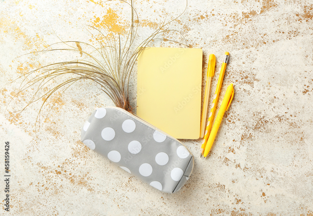 Set of stationery supplies on color background