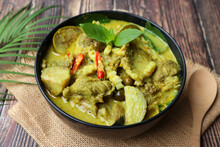 Thai Green Curry With Beef Served In Bowl Of The Wood Table - Thai Food Called Kang Keow Wan