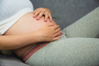 © Suriyo - pregnant woman holding her stomach